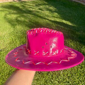 Magenta pink cowboy hat with white and red embroidered detail